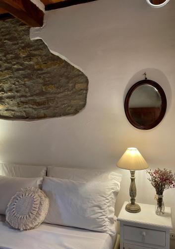 Letto o letti in una camera di Relais Il Pozzeto
