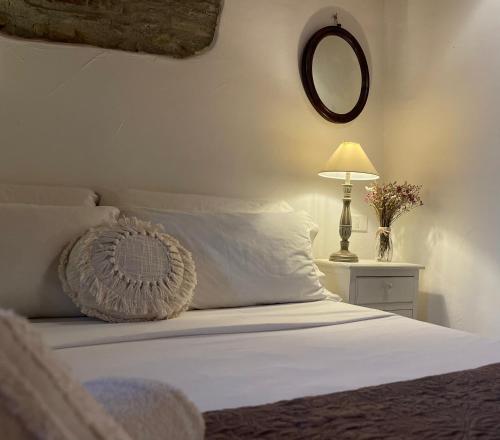 Letto o letti in una camera di Relais Il Pozzeto