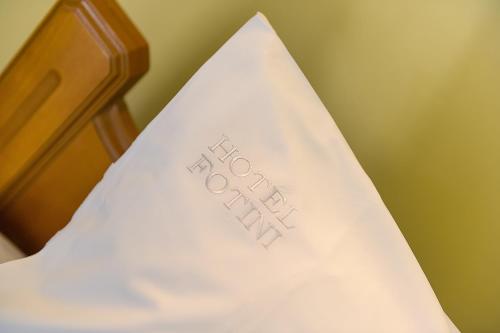 a white napkin with the word bed written on it at Hotel Fotini in Kalamata