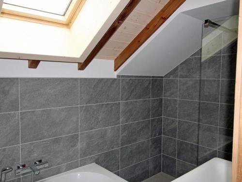 a bathroom with a shower and a bath tub at Gîte 4 étoiles avec sauna et terrasses pour 14 pers. - FR-1-589-319 in Ventron