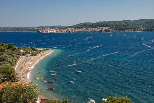 a view of a beach with boats in the water at Lulak Studio Apartments in Orebić