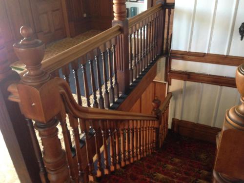 an overhead view of a wooden spiral staircase at Tripinn Modern Motels & Affordable Accommodation in Westport