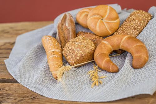 a plate of different types of bread and pastries at Ferienhaus Holzer in Weissensee