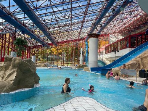 a group of people in a swimming pool at "Altes Haus" am Kurpark in den Bergen in Zorge