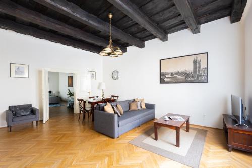 a living room with a couch and a table at St. George Apartments in Prague