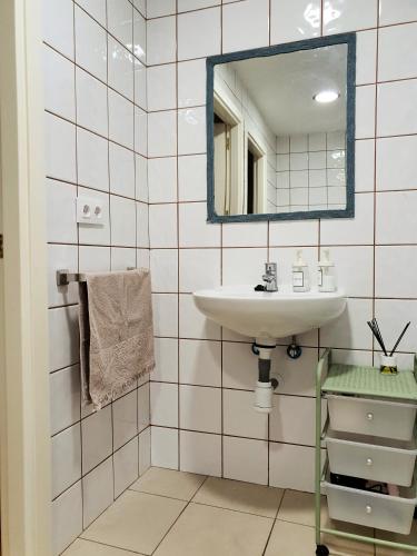 a bathroom with a sink and a mirror at Apartamento Rural la Fontanina TRCC0087 Complejo la Fontanina in Mata de Alcántara