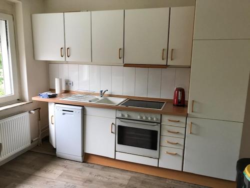 Η κουζίνα ή μικρή κουζίνα στο Clarkes Apartments