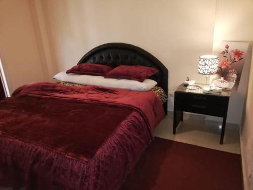 A bed or beds in a room at Comfortable studio in madinaty compound B11