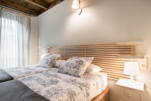A bed or beds in a room at Tulmas by Totiaran