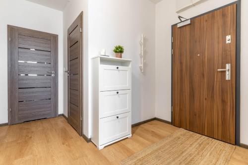 Kuchyň nebo kuchyňský kout v ubytování WrocApartments StarCenter - Parking Free