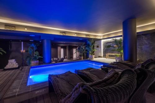 a swimming pool in the middle of a house at The Capital 15 on Orange Hotel & Spa in Cape Town