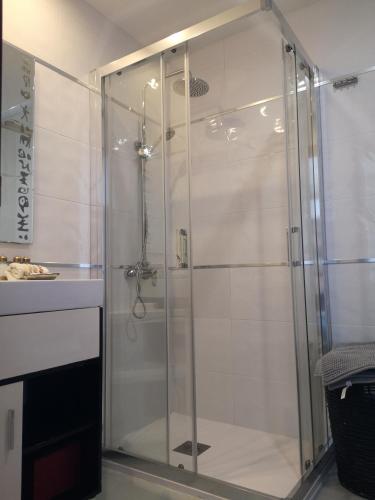 a shower with a glass door in a bathroom at Apartamento Benalmádena costa, Torremuelle in Benalmádena