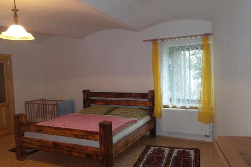 Кровать или кровати в номере Bezbariérové ubytování na statku