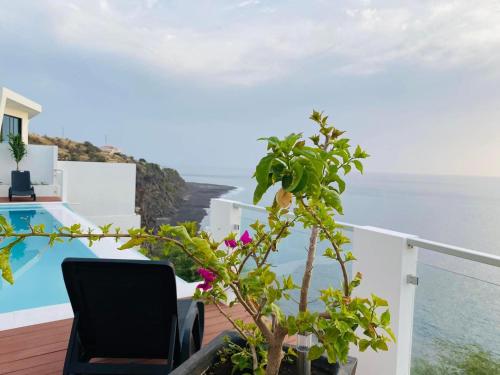 a view of the ocean from the balcony of a villa at Fogo Boutique Hotel in São Filipe