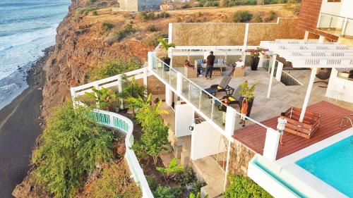 an aerial view of a house with a view of the ocean at Fogo Boutique Hotel in São Filipe