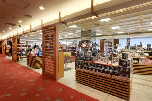 a store aisle of a store with a lot of products at Asaya in Nikko