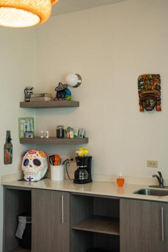 a kitchen with a counter with a skull on it at La Esmeralda PR in San Juan