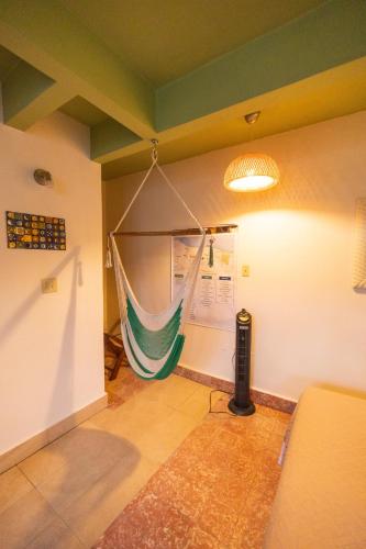 a room with a hammock hanging from the wall at La Esmeralda PR in San Juan