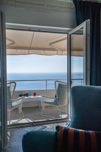 a living room with a table and chairs on a ship at Libera Apartments in Stara Baška