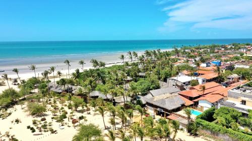 an aerial view of a resort and the beach at Pousada do Norte in Jericoacoara