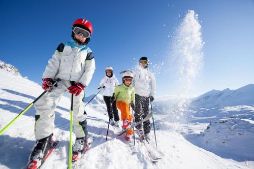 a group of people on skis in the snow at Das Lafairs in Pfunds