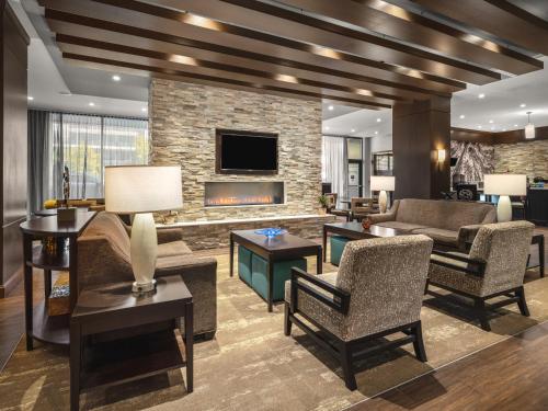 a living room filled with furniture and a fireplace at Staybridge Suites Seattle - South Lake Union by IHG in Seattle