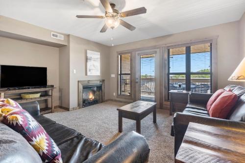 a living room with a couch and a fireplace at Table Rock Resorts at Indian Point in Branson
