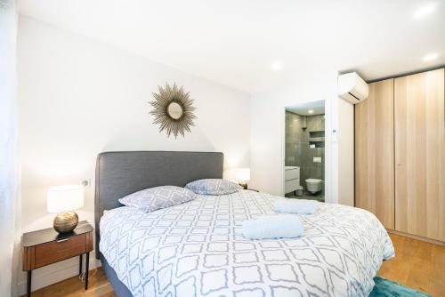 a bedroom with a bed with two pillows on it at Elégant - Hypercentre - Croisette - Palais - AK in Cannes