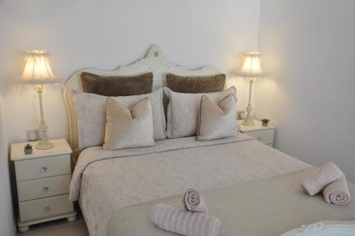 a bedroom with a large bed with two night stands at Mojacar Apartment Near the Beach with Private Pool in Mojácar