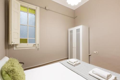 Postel nebo postele na pokoji v ubytování Sagrada Familia I by Enjoy Apartments