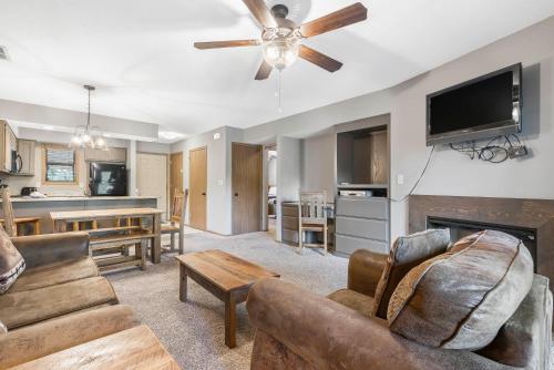 a living room with a couch and a fireplace at Table Rock Resorts at Indian Point in Branson