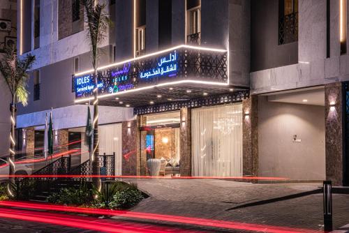 a building with a sign on the side of it at idles By Staytion Serviced Apartments in Jeddah