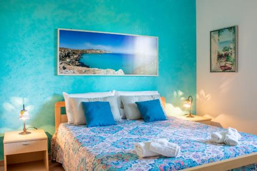 A bed or beds in a room at Villino Agave