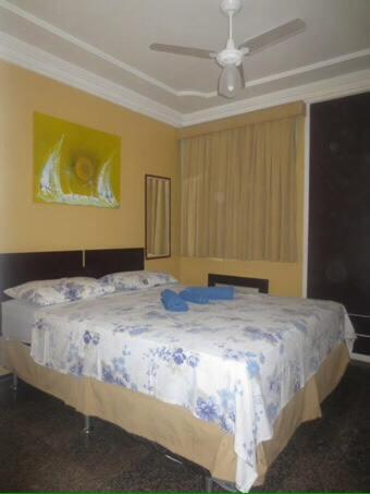 a bedroom with a bed with a blue towel on it at Apartamento em Meireles, Praia de Iracema in Fortaleza