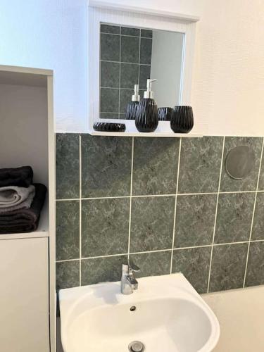 Koupelna v ubytování Appartement à Roubaix