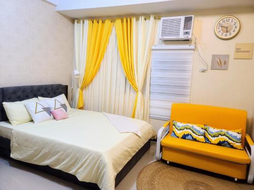 a bedroom with a bed and a window at House of B&Y at 101 Newport across NAIA T3 in Manila