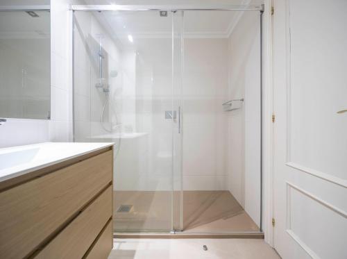 a shower with a glass door in a bathroom at Paraguay 14 in Vigo