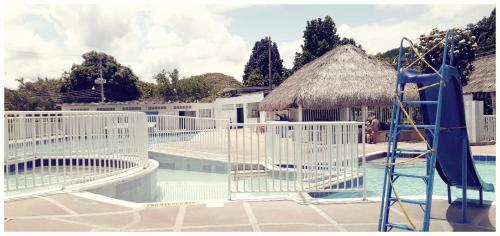 a water park with a water slide and a playground at Villa Aurora in Ricaurte