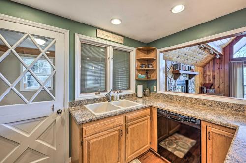 a kitchen with a sink and a window at Spacious Franklin Cabin w/ Mountain Views! in Franklin