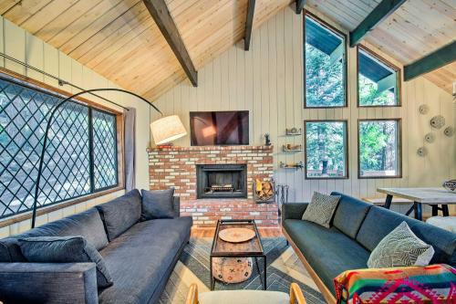a living room with a couch and a fireplace at Twin Peaks Cabin Less Than 4 Mi to Lake Arrowhead! in Twin Peaks