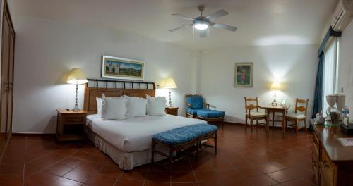 Ένα ή περισσότερα κρεβάτια σε δωμάτιο στο Hotel Boutique Casa de Campo
