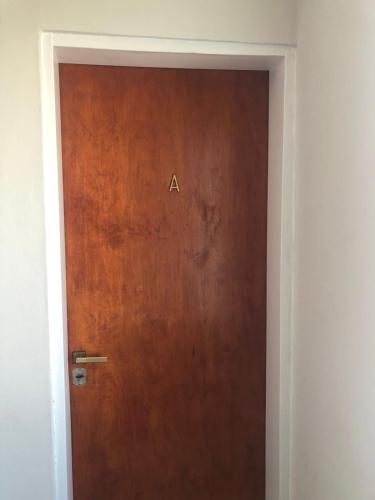 a door with the letter a written on it at CALAFATE CENTER APARTS in El Calafate