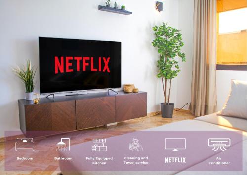 a tv in a living room with a netflix sign on it at YourPlace Rabat Agdal 1 - Cozy Residence in Rabat