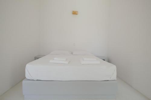 Ένα ή περισσότερα κρεβάτια σε δωμάτιο στο Elia Suites