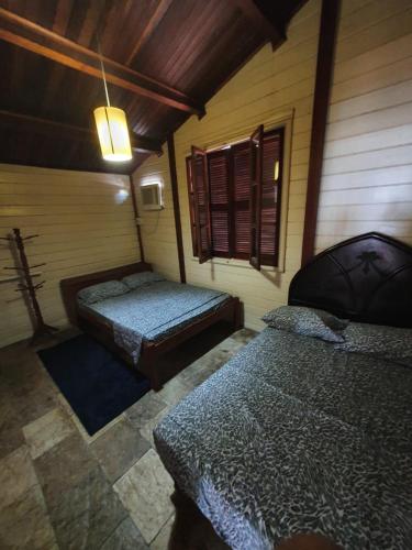 Кровать или кровати в номере Casa Maneira Serrambi