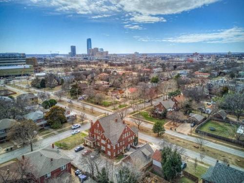 an aerial view of a city with a red building at Historic 1920s Brick Beauty in Medical District in Oklahoma City