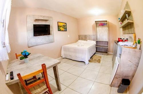 Ένα ή περισσότερα κρεβάτια σε δωμάτιο στο Pousada SDOIS