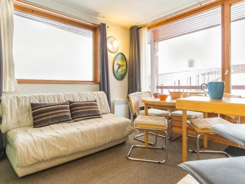 a living room with a couch and a table at Appartement Les Arcs 1800, 2 pièces, 4 personnes - FR-1-346-497 in Arc 1800