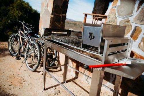 a table with a laptop on it next to bikes at Fossil Hills in McGregor