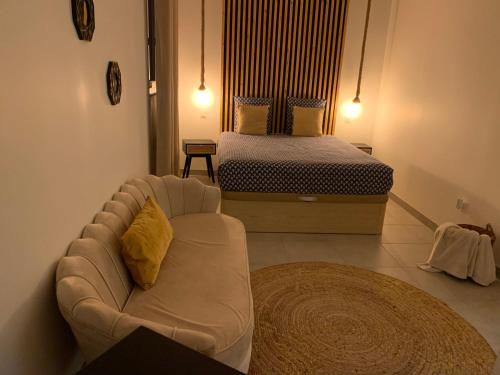 מיטה או מיטות בחדר ב-Sandspa logement avec jacuzzi